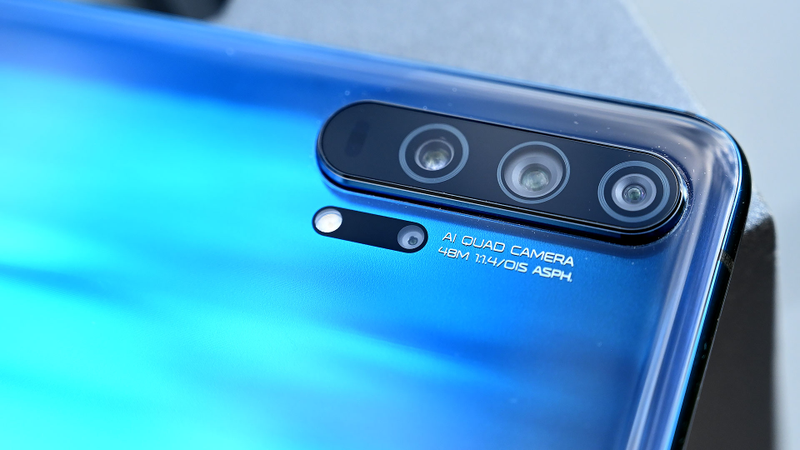 The tiny lens below the three main cameras is the Honor 20 Pro’s macro cam.